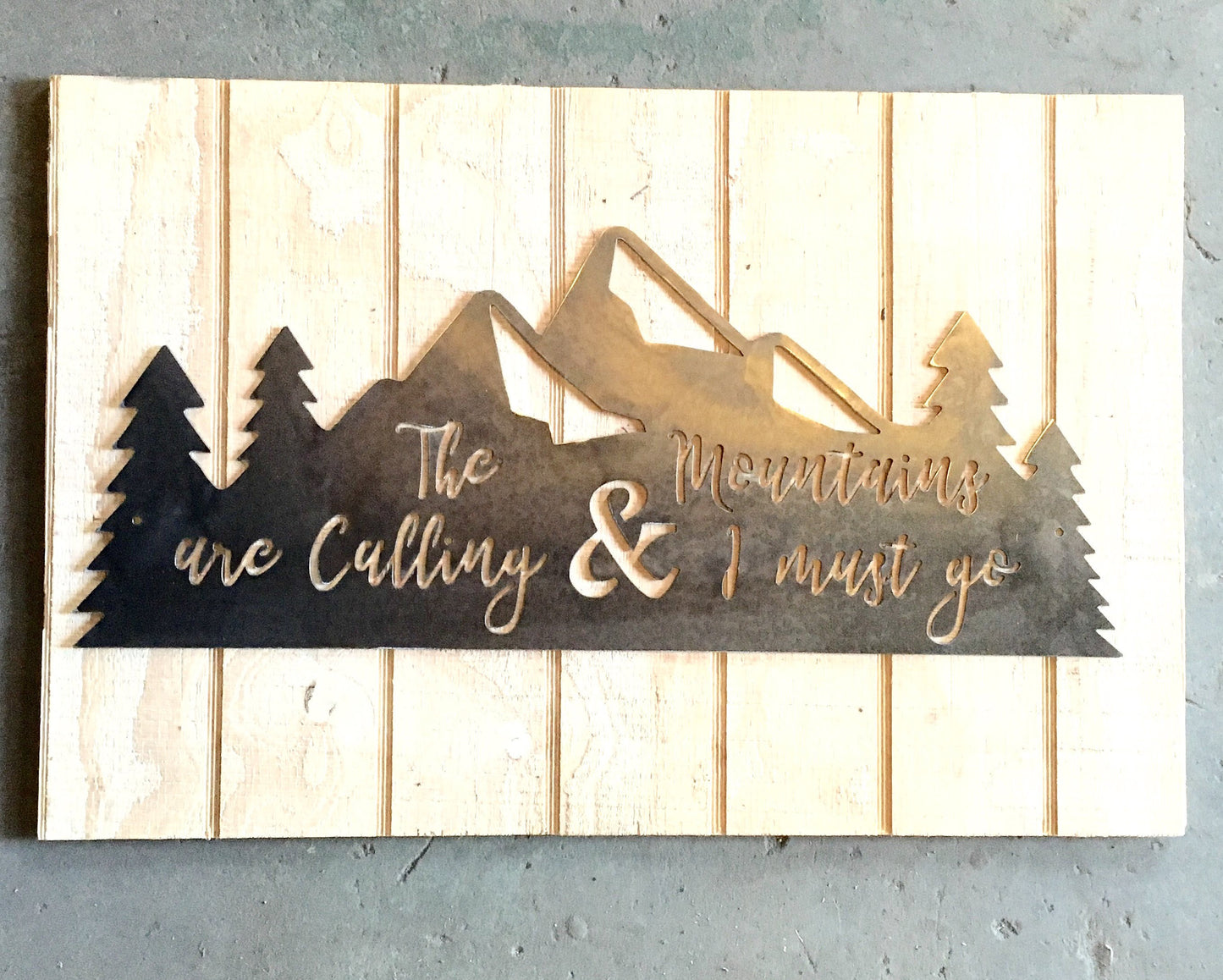 The Mountains Are Calling & I Must Go metal sign