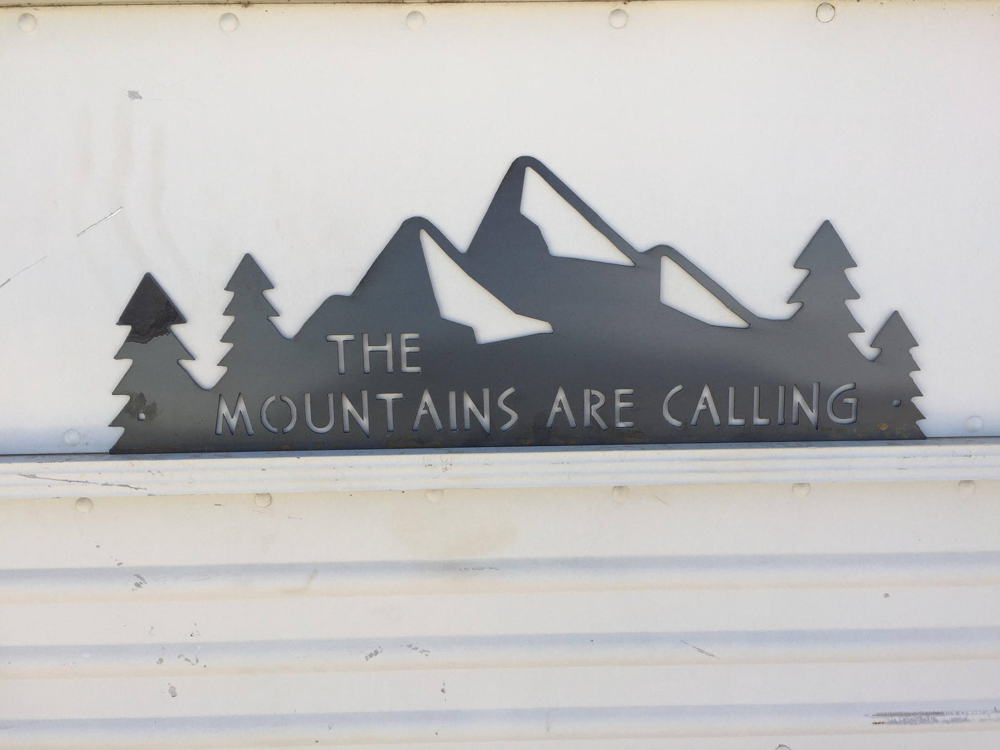 The Mountains Are Calling metal sign