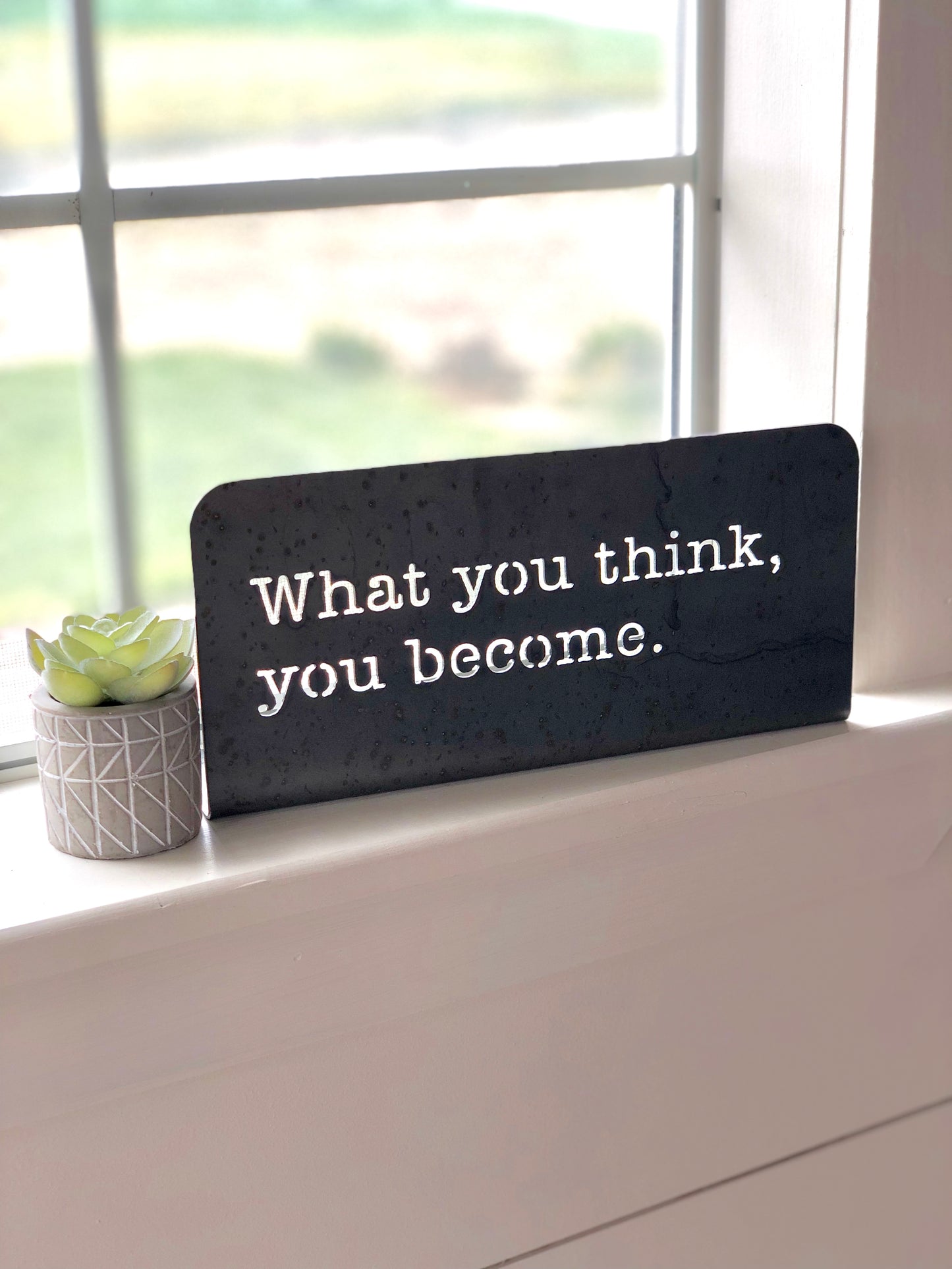 What you think, you become Standing metal mindfulness sign